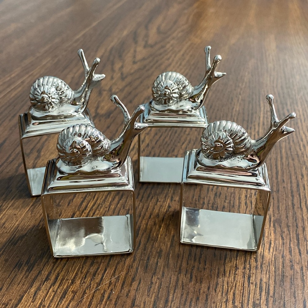 Mary Jurek Design Inc set of eight metal snail napkin holders